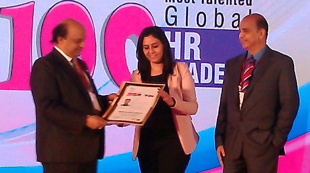 Suman Peswani receiving award